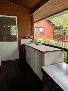 an outdoor kitchen with a counter and a sink at Yun Hsiang Zhan Chalet in Hualing