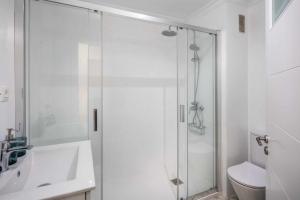 a bathroom with a shower and a sink and a toilet at Apartamento Jardín 1 in Las Palmas de Gran Canaria +21 photos