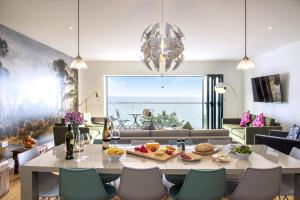 a living room with a table with food on it at Cormorant in Torpoint