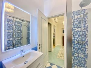 a bathroom with a sink and a mirror at CasaViva - Family Home in Santa with AC in Santa Margherita Ligure