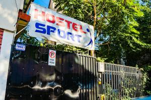 a sign that says hostel support on a fence at HOSTEL SPORT BUCHAREST in Bucharest