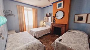 A bed or beds in a room at Casa de Huespedes Dolce Vita