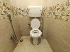 a bathroom with a white toilet in a shower at Hotel Star of Kurla - Nearest from Kurla - Near BKC in Mumbai