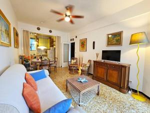 a living room with a couch and a flat screen tv at [ Portofino ] Centro di Rapallo in Rapallo
