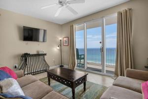a living room with a view of the ocean at Majestic Sun 904B in Destin