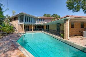 a swimming pool in front of a house at Houston Home near Medical Center and NRG Stadium! in Houston