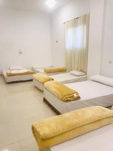 a room filled with lots of beds in it at Alam B&B in Marsa Alam City +68 photos