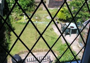 a view from a window of a yard with a park at Liverpool Airport Rooms in Speke