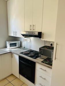 Kuchyň nebo kuchyňský kout v ubytování Saint Airbnb