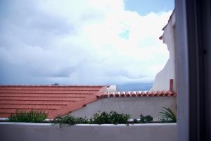 a view from a balcony of a house with a roof at Montalma in Monchique