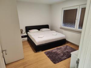 A bed or beds in a room at Dino Sarajevo Apartment