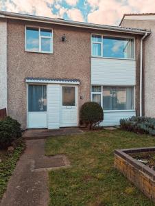 a brick house with white doors and windows at Lavender View in Grantham