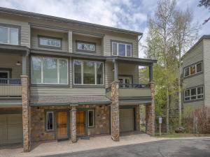 a large house with a balcony on a street at Coldstream Townhome 19 in Vail