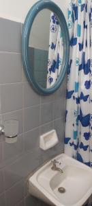 a bathroom with a sink and a mirror at dpto centrico con oficina consultorio in La Rioja +23 photos