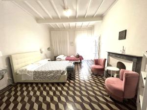 Postel nebo postele na pokoji v ubytování Allegra Toscana - Affittacamere Guest house Arezzo