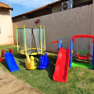 a group of playground equipment on the grass at Casa Viva Bonito in Bonito