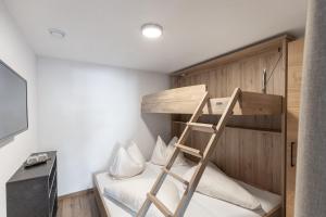 Rúm í herbergi á Hotel Garni Birkhahn