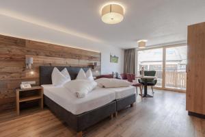 Rúm í herbergi á Hotel Garni Birkhahn