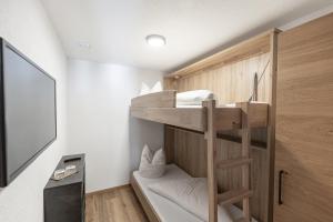 Rúm í herbergi á Hotel Garni Birkhahn