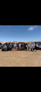 a large group of people standing in a line at Excursion dakhla tour in Dakhla