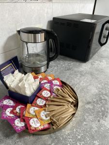 a counter with a food processor and a plate of food at Mini Hotel in Liski