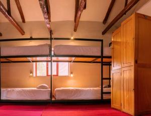 a room with four bunk beds in it at Valle verde, Hostel & camping in Urubamba +65 photos