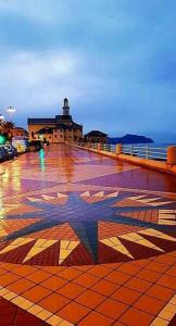 a tile floor with a star painted on it at Lido Blu in Genova