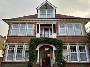 a red brick house with an arch over the door at The Sandrock in Clacton-on-Sea