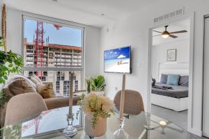 a living room with a glass table and a window at Beautiful Unit with Amazing View & Free Parking in Miami +60 photos
