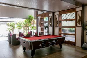 a billiard room with a pool table in it at A Sleep Bangkok Sathorn in Bangkok