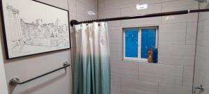 a shower with a curtain and a window in a bathroom at Tranquil Oasis- Private Rooms -Near Downtown Indianapolis in Indianapolis