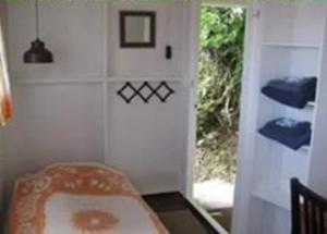 Voodi või voodid majutusasutuse El Momo Cottages toas