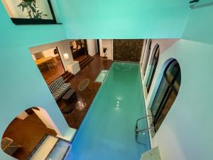 a swimming pool in the middle of a house at Riverside House with Indoor Pool in Johannesburg
