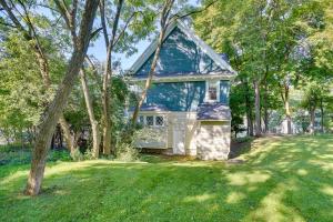 a small house in the middle of a yard at Cozy Westcott Home about half Mi to Syracuse Campus! in Syracuse