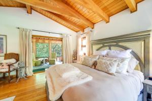 a bedroom with a large bed with a wooden ceiling at Butler Retreat on 60 Acres Near Beech Mountain! in Beech Mountain