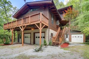 a large house with a deck and a garage at Butler Retreat on 60 Acres Near Beech Mountain! in Beech Mountain