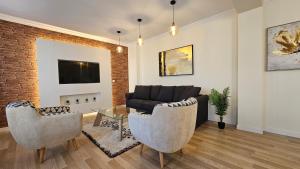 TV a/nebo společenská místnost v ubytování YFB I 130m2 Designwohnung mit 2 Bädern