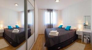 Ein Bett oder Betten in einem Zimmer der Unterkunft Apartments Diamond