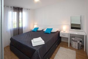 Ein Bett oder Betten in einem Zimmer der Unterkunft Apartments Diamond