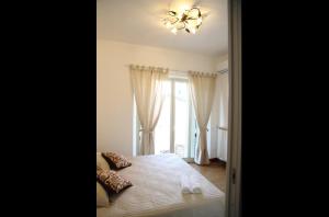 A bed or beds in a room at B&B Evelyne