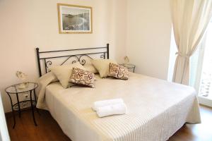A bed or beds in a room at B&B Evelyne