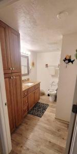 a bathroom with a sink and a toilet at Condo Daytona Beach in Daytona Beach Shores