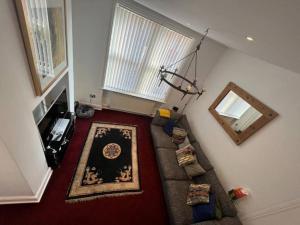 an overhead view of a living room with a couch at The Townhouse in Waterloo sleeps 4 in Waterloo