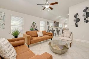 a living room with a couch and chairs and a table at IAH-Houston Hideaway - Free Parking, WiFi, Sleeps 10 in Humble