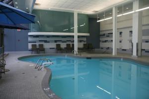 a large swimming pool in a building at Delta Hotels by Marriott Edmonton South Conference Centre in Edmonton