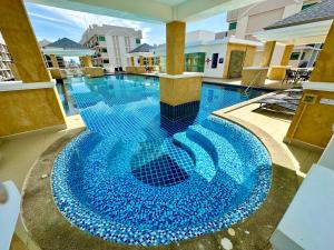 Mynd úr myndasafni af Arcadia Condo with Pool access-E & Gym-Sauna and Fast NET í Pattaya South