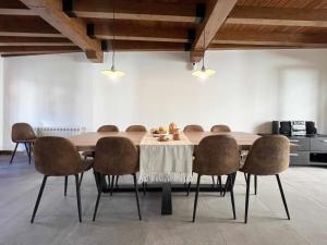 a dining room with a table and chairs at Casa Baronia La Cerdanya in Puigcerdà