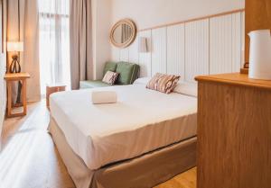 Tempat tidur dalam kamar di Casa Bassa Hotel