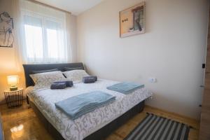 Krevet ili kreveti u jedinici u okviru objekta Apartman Iris