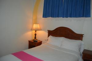 Postel nebo postele na pokoji v ubytování Hotel Meson del Mar